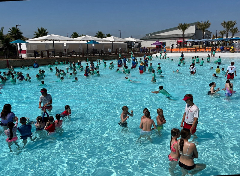 Wild Rivers swim instructors guide children on how to submerge and blow bubbles underneath the water; this breath control is a necessary skill to learn to prevent inhalation of water.